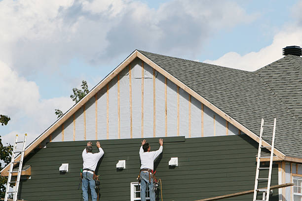 Professional Vinyl Siding technician working in Long Beach, IN
